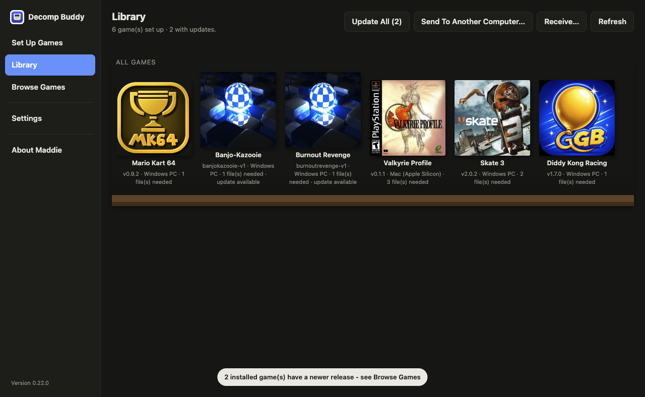 The Library screen: a wooden bookshelf of installed games with their box art - Mario Kart 64, Banjo-Kazooie, Burnout Revenge, Valkyrie Profile, Skate 3, Diddy Kong Racing.